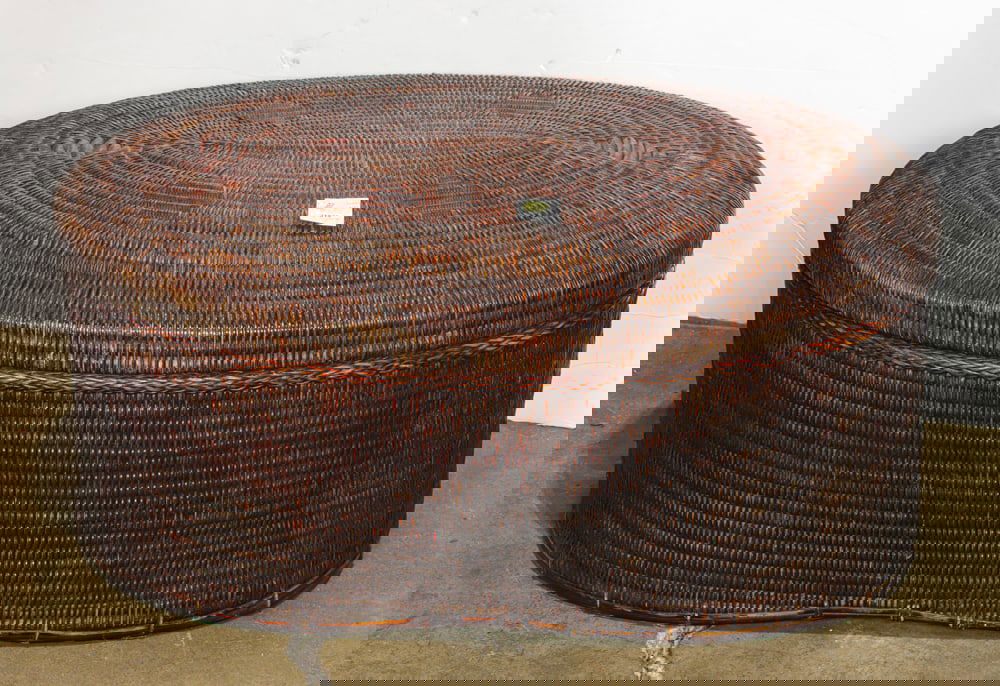 A woven bamboo oval basket from the Philippines: A woven bamboo oval basket from the Philippines. 20th century, 13"h x 27"w x 20"d.