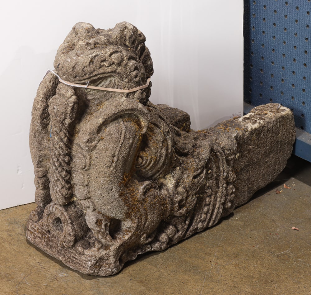 A Javanese volcanic rock rain spout: A Javanese volcanic rock rain spout. Carved in the form of a Makara, 14th century, 16"h x 7.5"w x 19"d.