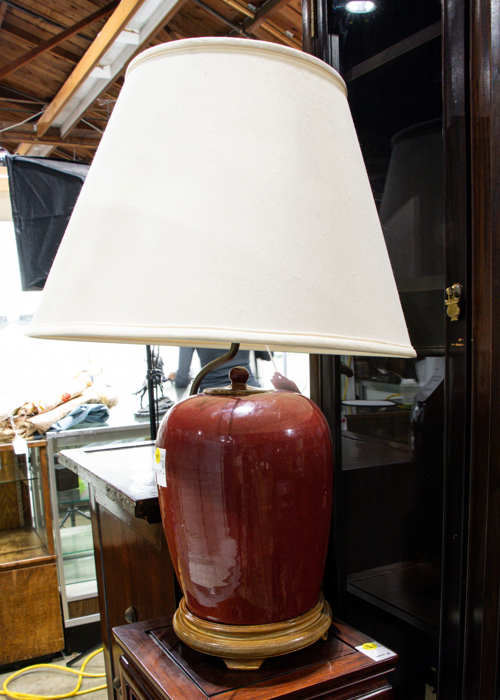 A Chinese ox-blood glazed vase: A Chinese ox-blood glazed vase. Mounted as a lamp, 19th century, 27.5" high.