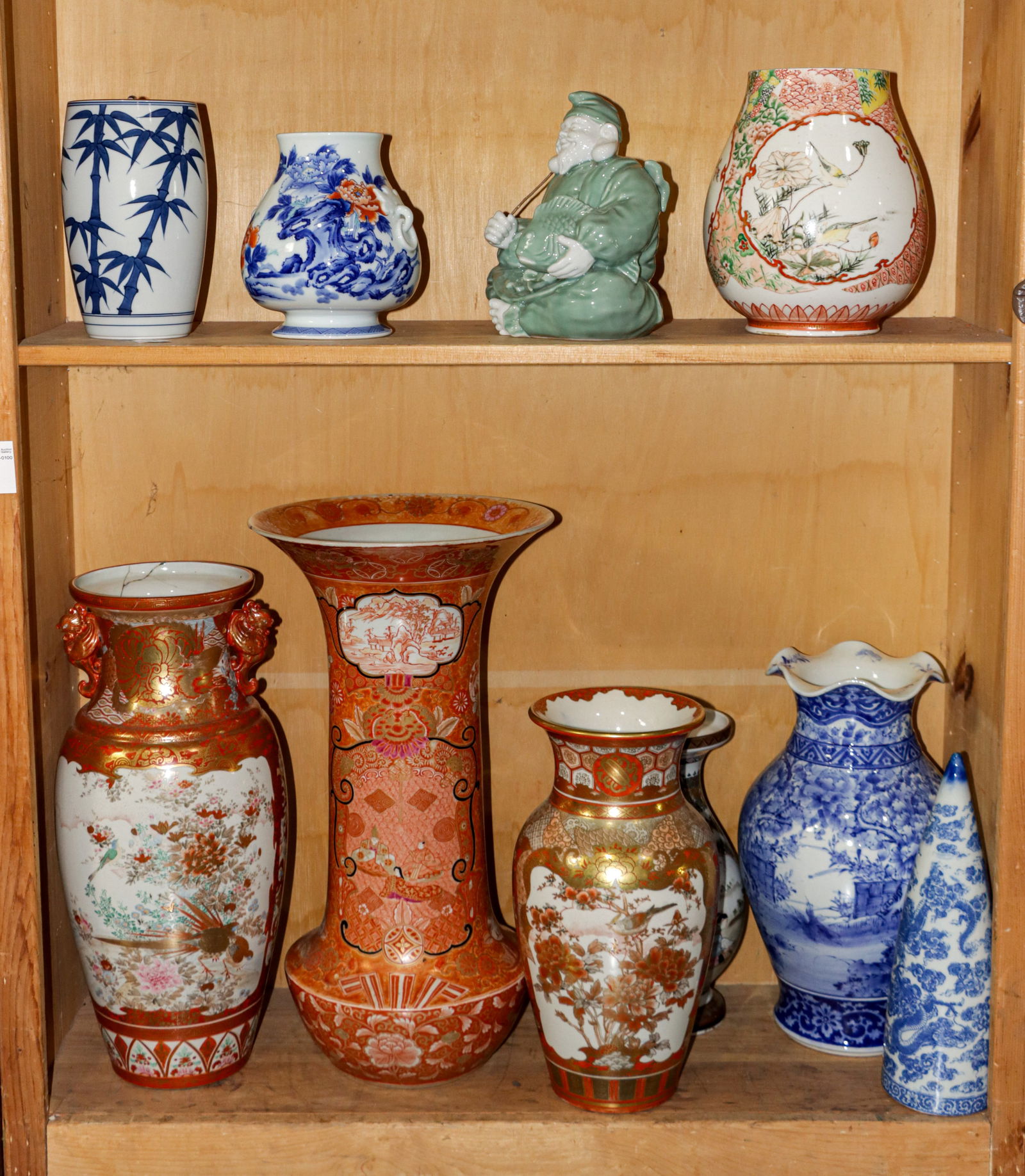 Two Shelves of Japanese ceramics articles: Two Shelves of Japanese ceramics articles. 20.75" high.