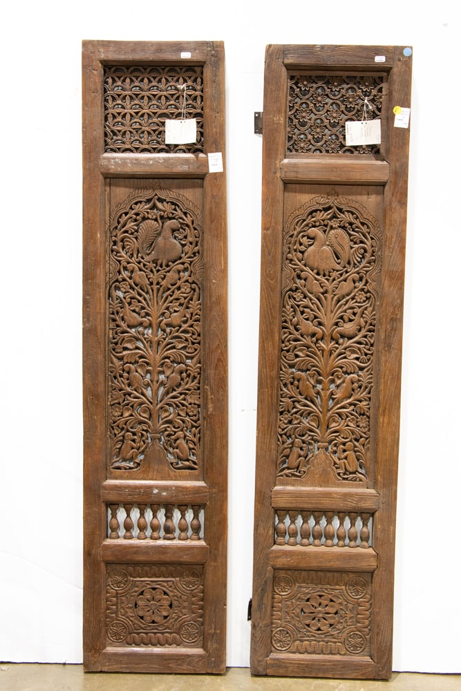 A pair of Indian carved wood windows: A pair of Indian carved wood windows. 18th century, 58"h x 13"w.