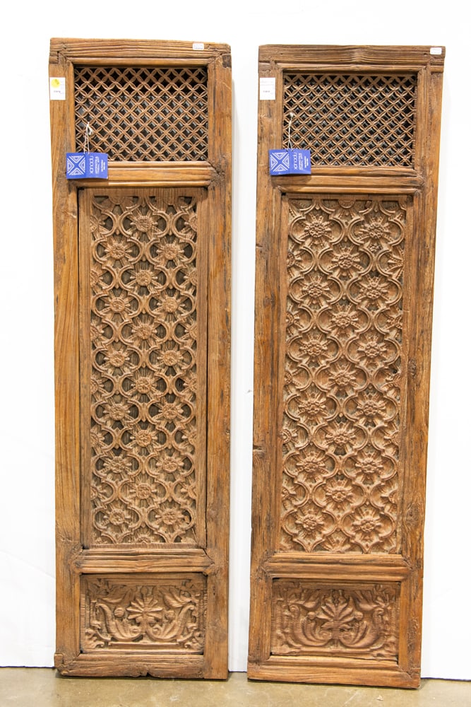 A pair of Indian carved wood windows: A pair of Indian carved wood windows. 18th century, 53"h x 15"w.