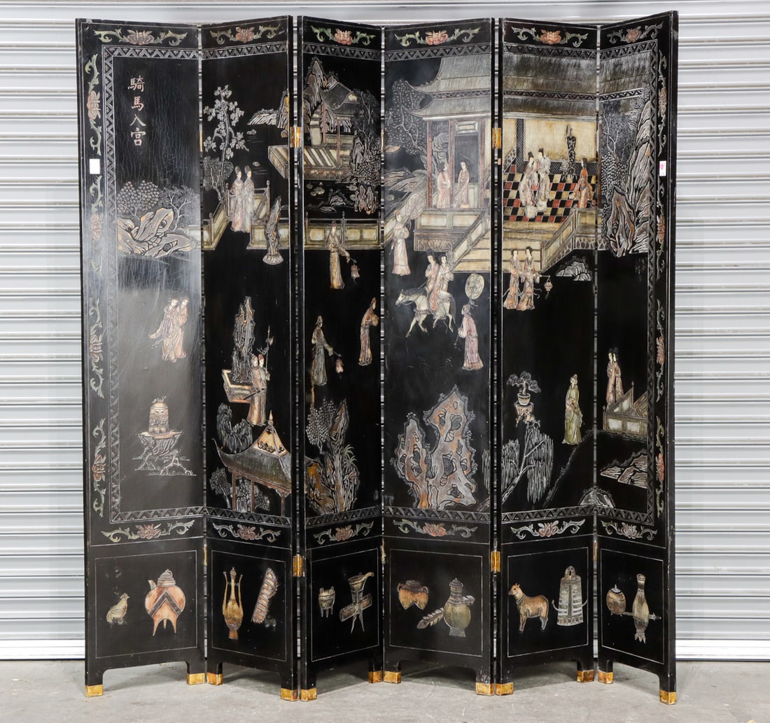 A Chinese six-panel black lacquer coromandel style screen (1 of 2)