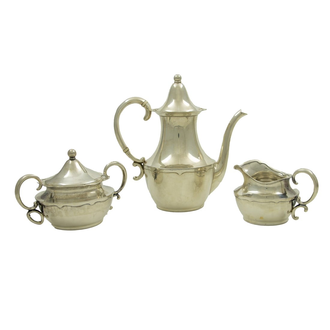 An American Arts & Crafts sterling tea service, Shreve & Co., San Francisco, pattern 652, early 20th: A three-piece American sterling tea service, Shreve & Co., San Francisco, pattern 652, early 20th century, each in the Arts & Crafts style with gently hammered borders, comprising (1) teapot, 8"h"; (1