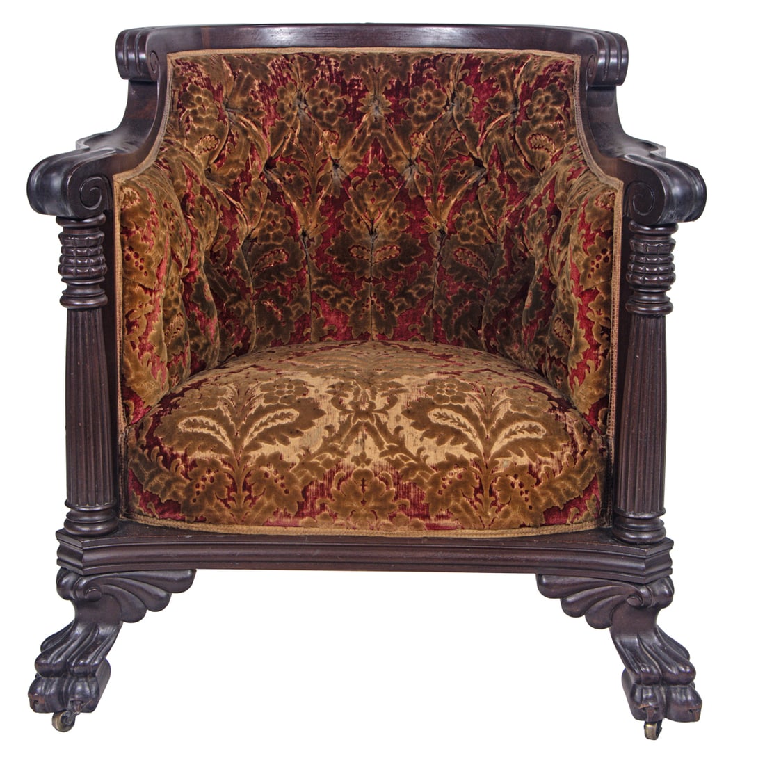 An English style mahogany and button tufted club chair: An English style mahogany and button tufted club chair, the exposed frame with tufted back, over scrolled arms on columnar supports ending in hairy paws with casters, 34.5" x 32.5"w; 17"h x 19"d