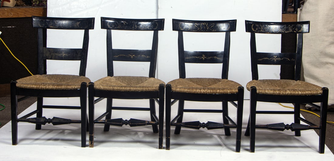 A set of four Hitchcock style side chairs: A set of four Hitchcock style side chairs, each with ebonized and stencil decorated frame and rush seat, 34"h x 21"w x 19.5"d (seat), Provenance: From the Estate of Margaret G. Huntington; by descent