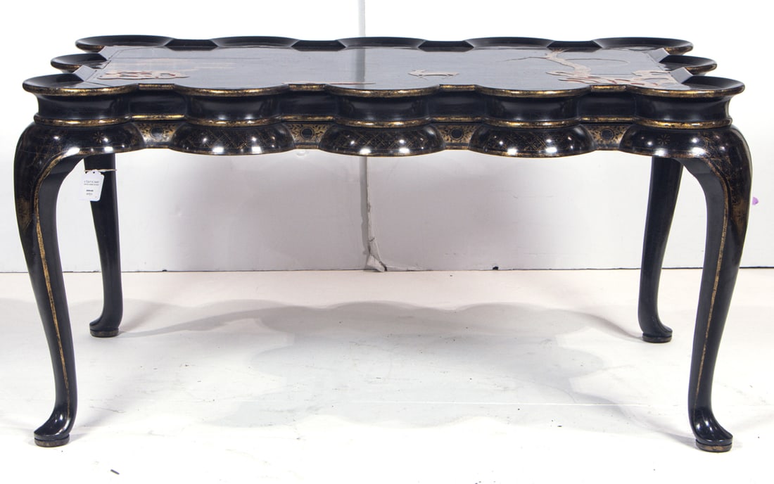 A Rose Tarlow Chinoiserie decorated lacquer coffee table: A Rose Tarlow Chinoiserie decorated lacquer coffee table, the dished lobed top decorated with deer in a landscape with pagoda and pierced rockwork, raised on cabriole legs and ending in pad feet, unma