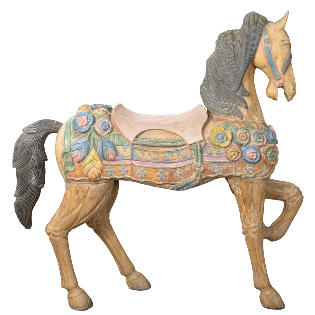 A polychrome decorated carousel horse: A polychrome decorated carousel horse, in prancer stance, festooned with floral saddle blanket, 55"h x approx. 52"l