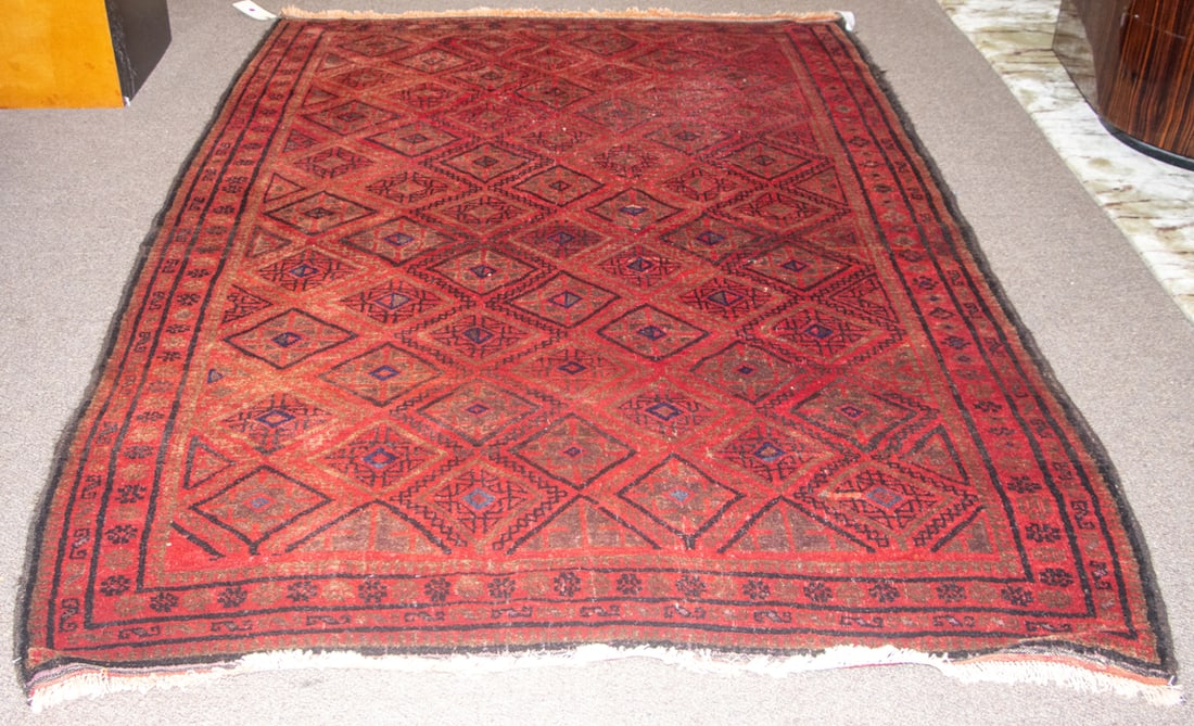 An antique Afghan carpet (1 of 3)