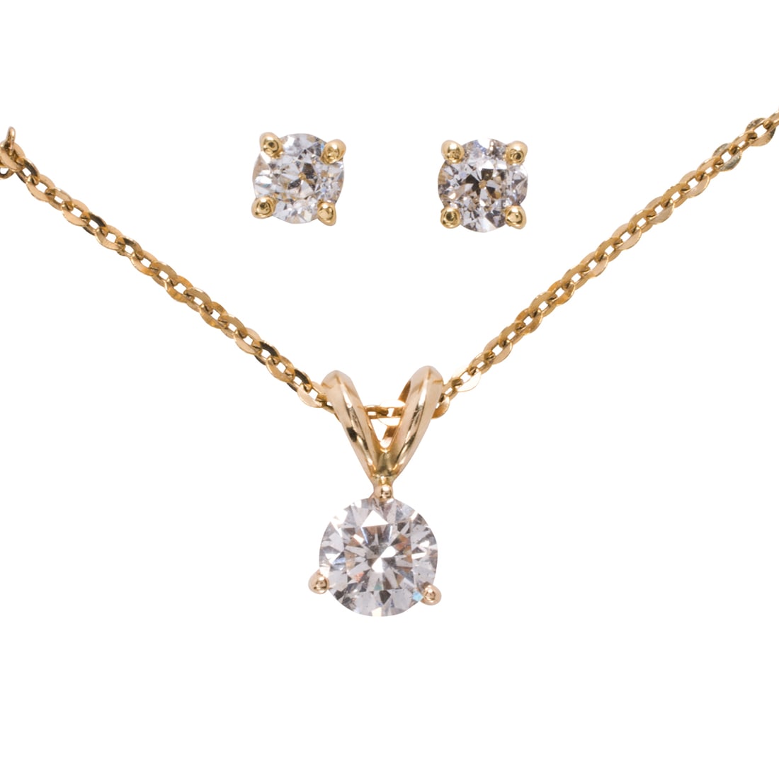 A diamond and gold solitaire pendant necklace and earrings (1 of 2)