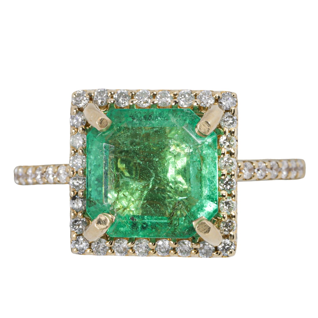 An emerald, diamond and 14k gold ring: An emerald, diamond and 14k gold ringCentering an emerald-cut emerald weighing 2.73 carats, framed by round brilliant-cut diamonds; total diamond weight: 0.38 carats; 4.70 grams