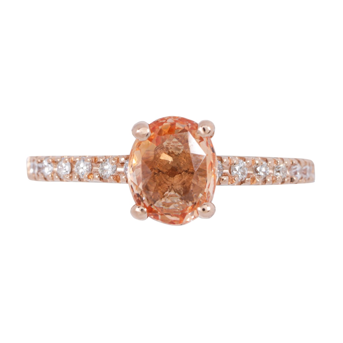 An unheated orange sapphire, diamond, and 14k rose gold ring: An unheated orange sapphire, diamond, and 14k rose gold ringCentering an oval-cut unheated orange sapphire weighing 1.05 carats, with round brilliant-cut diamond shoulders; size 6 1/2; 2.70 grams Acco