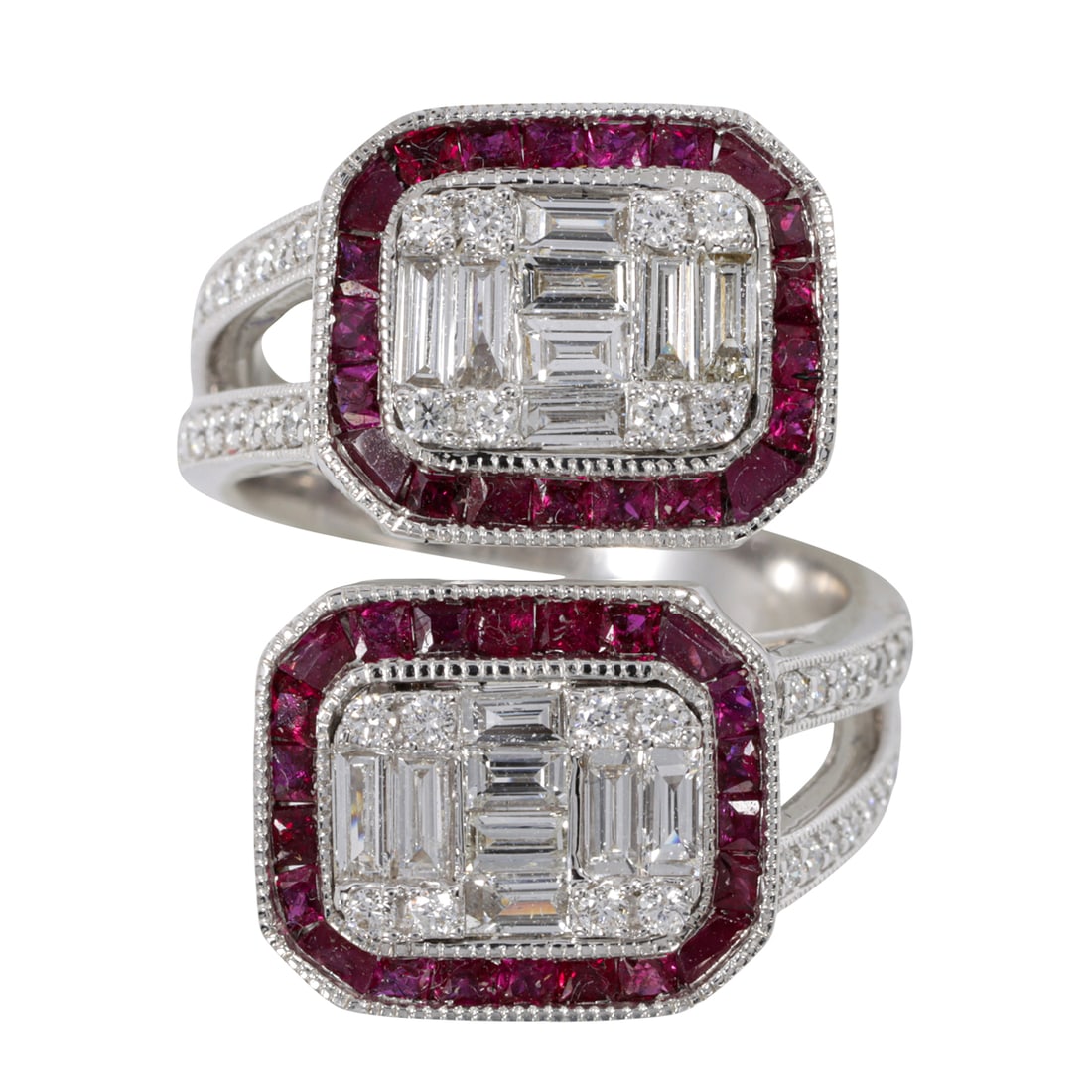 An Art Deco style diamond, ruby, and 18k white gold ring: An Art Deco style diamond, ruby, and 18k white gold ringOf bypass design, featuring an arrangement of baguette and round brilliant-cut diamonds framed by square-cut rubies, with round-cut diamond shou