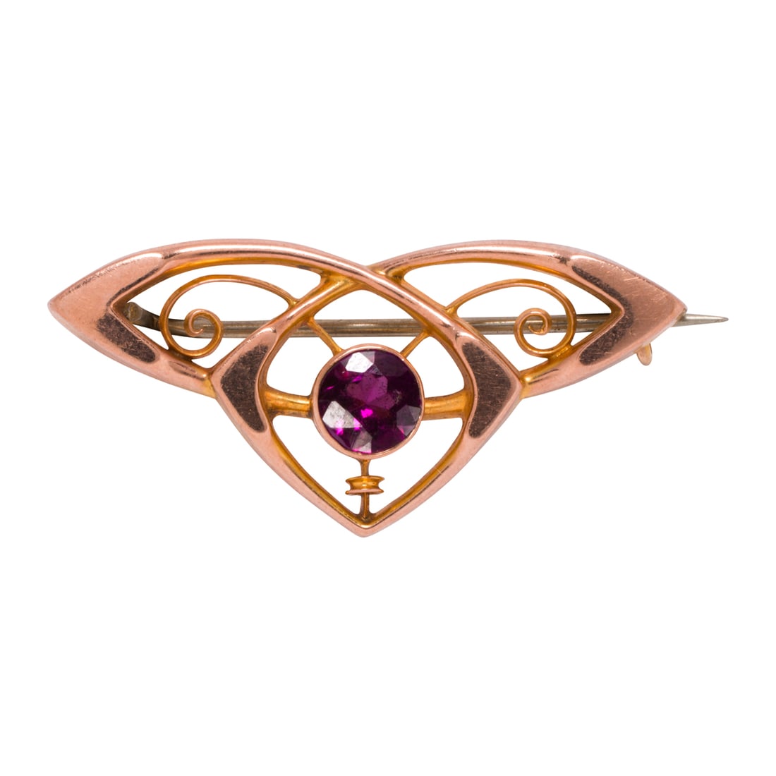 An antique synthetic sapphire and 9k rose gold brooch: An antique synthetic sapphire and 9k rose gold broochset with a round-cut reddish-purple synthetic sapphire, with white metal pin stem; length: 1 1/2 in; 1.89 grams