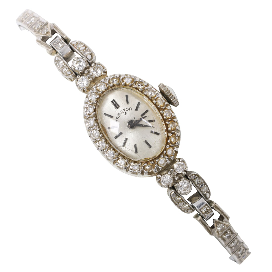 A Hamilton diamond and 14k white gold watch: A Hamilton diamond and 14k white gold watchCase no.: 372665The champagne-tone face, black stick indices, black stick hands, within polished 14k white gold case set with 26 single-cut diamonds, contain