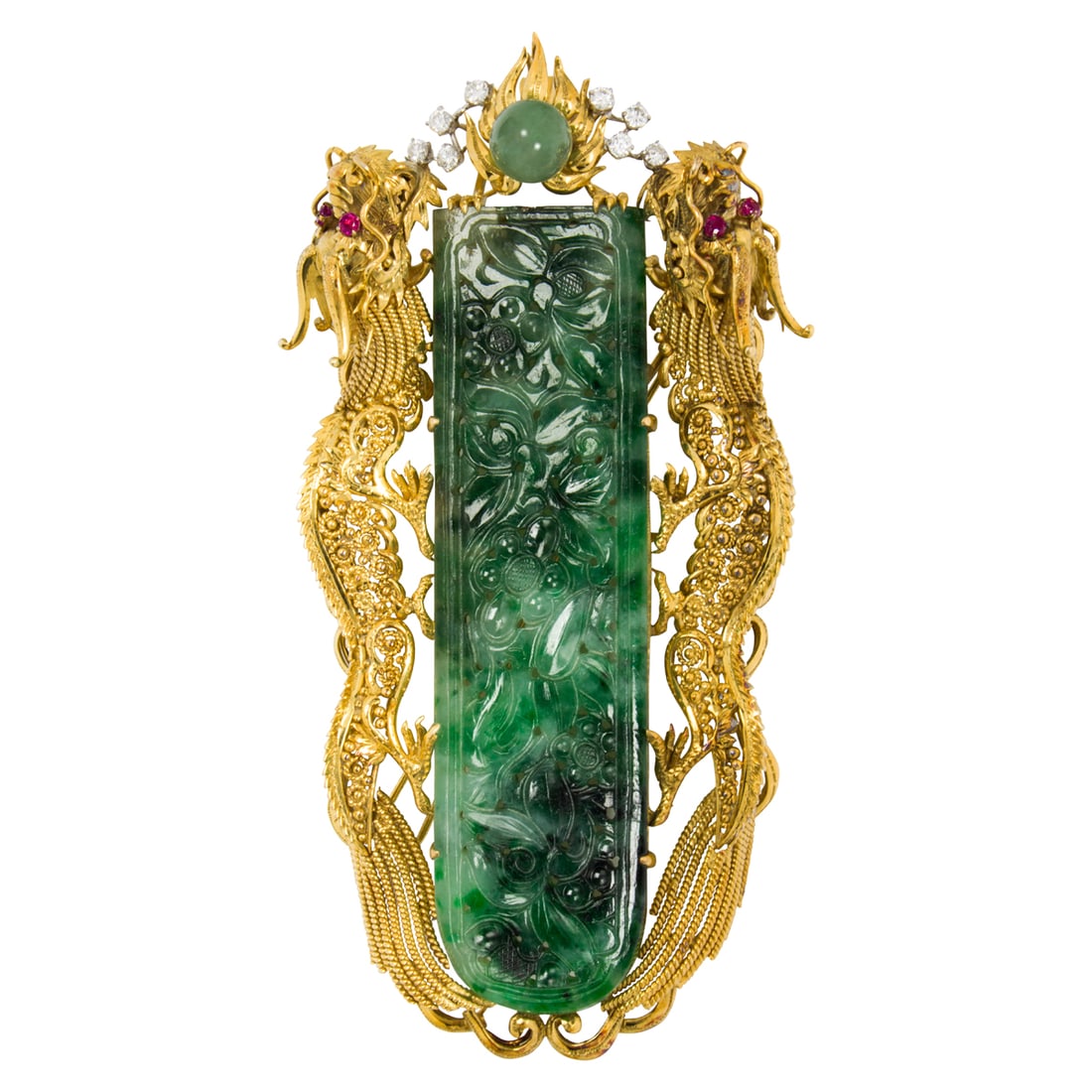 A jade, diamond, ruby, and 18k gold double dragon pendant-brooch: A jade, diamond, ruby, and 18k gold double dragon pendant-broochCentering an intricately carved, floriform jade tablet, framed within ornate, open-form 18k gold dragons with ruby eyes, accented by eig