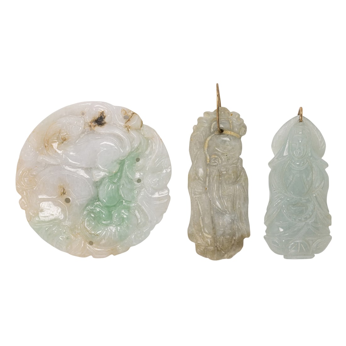 A carved jade pendant: A carved jade pendantDepicting animals and vegetation; width: 2 1/8 in; 34.85 grams
