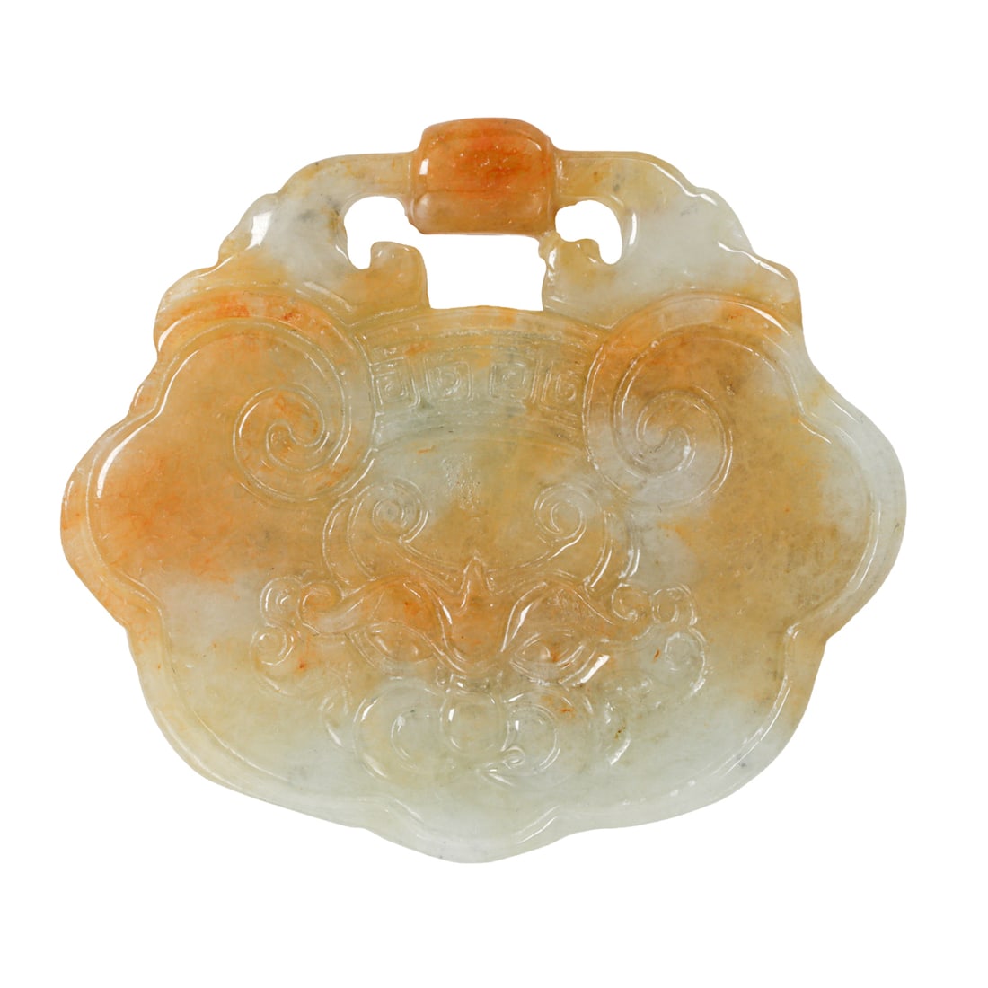 A jadeite pendant: A jadeite pendantDesigned as a dragon's head; 15.30 grams; length: 2 in