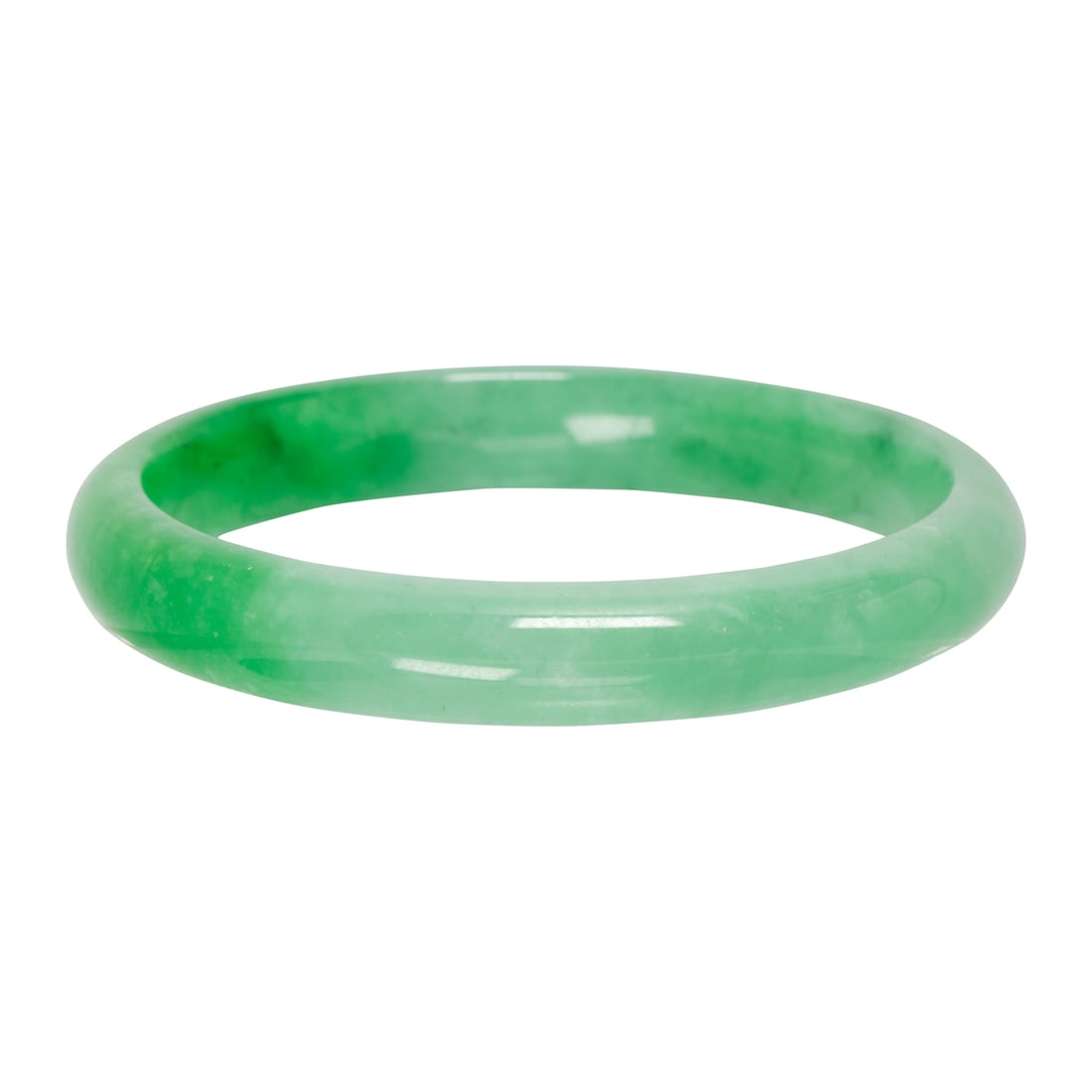 A jade bangle: A jade bangleof carved jade; diameter: 2 1/4 in; 30.15 grams