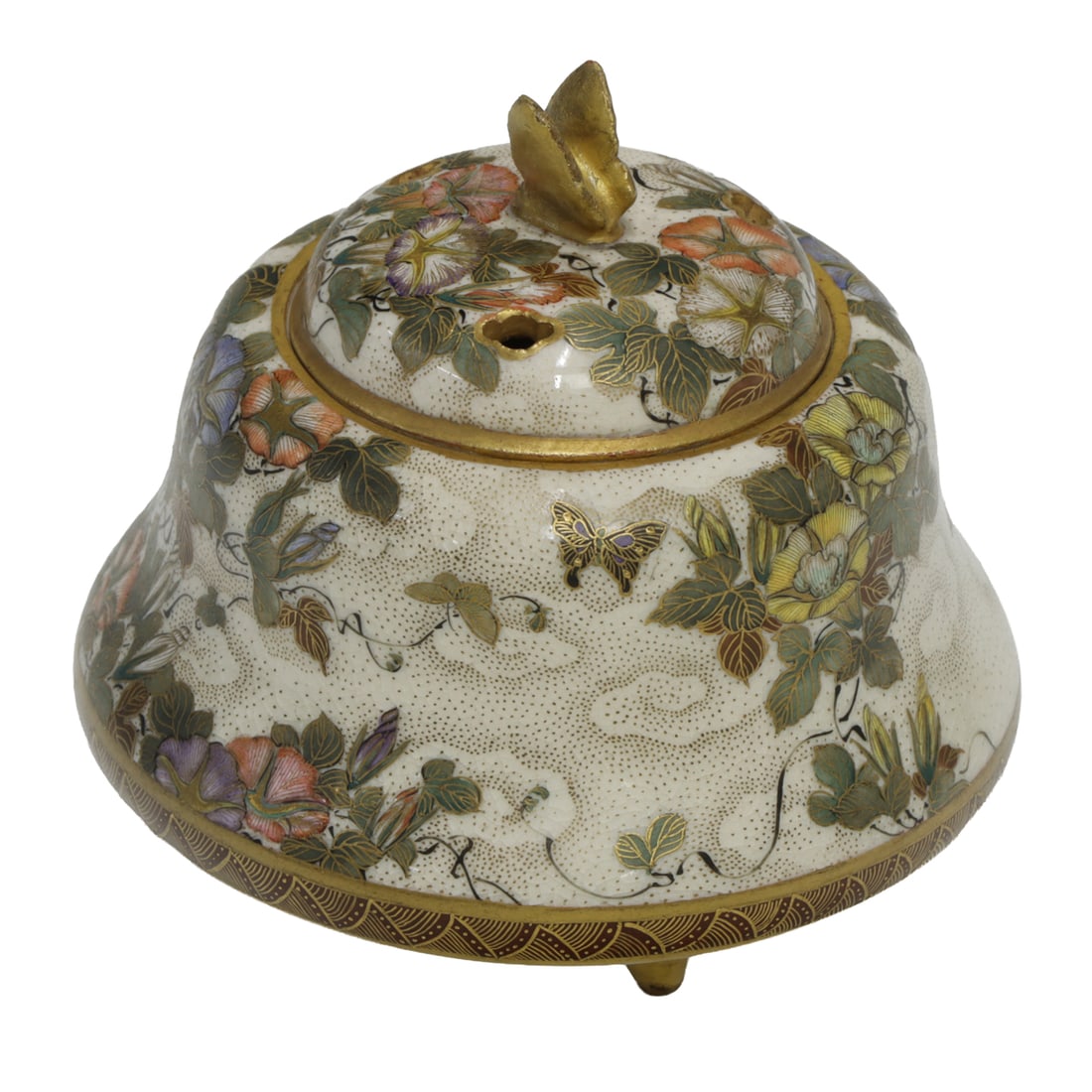 A Satsuma tripod koro: A Satsuma tripod koro. Featuring floral and butterfly motif, bearing Shizan mark, Meiji period, 2.875" high.