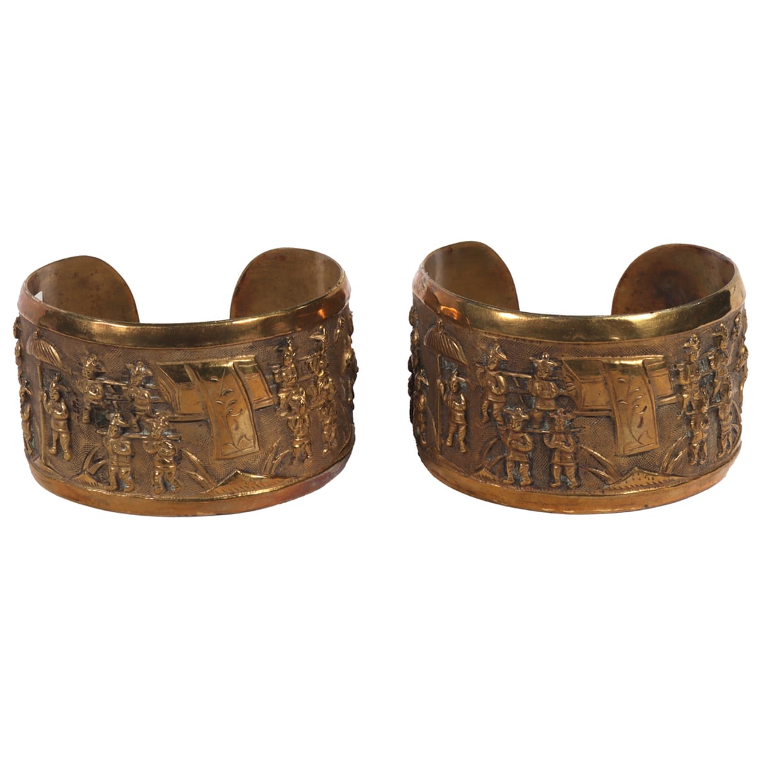 A pair of Chinese bronze or yellow brass bracelets: A pair of Chinese bronze or yellow brass bracelets. Depicting figural motif, from 2.625" to 2.75" across.