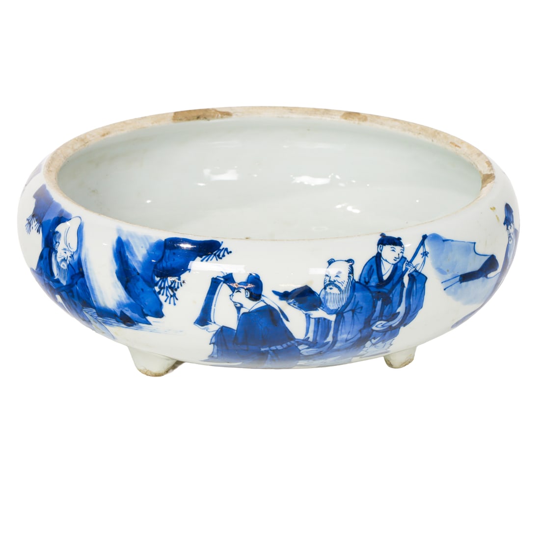 A Chinese blue and white tripod incense burner: A Chinese blue and white tripod incense burner. Depicting various figural motif, Kangxi period, 8.75" across. Provenance: A. Burlingame Johnson (c. 1856-1934) collection, now offered by his descendant