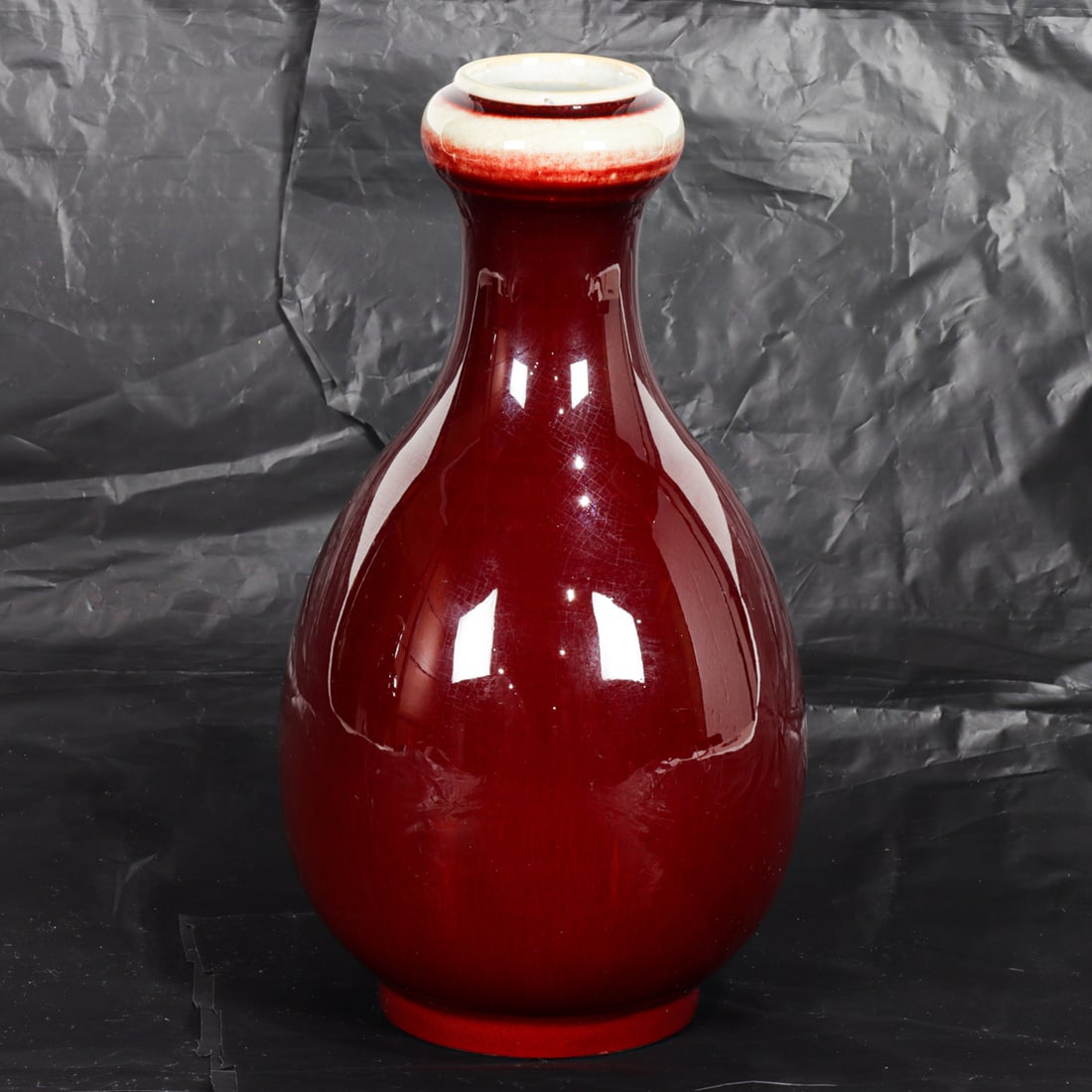 A Chinese ox-blood glazed garlic-head vase (1 of 5)