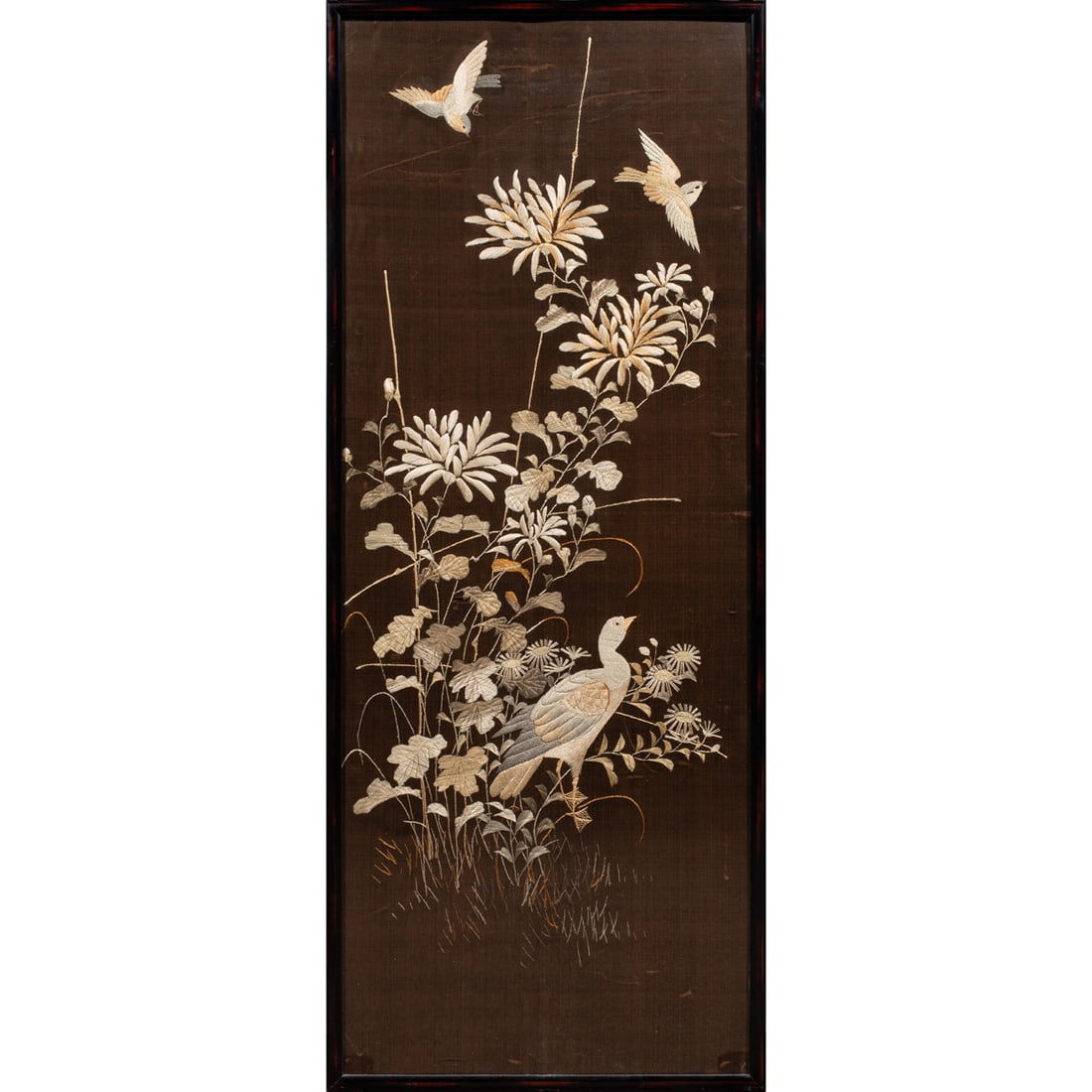 A pair of Chinese embroidered silk 'bird and flower' panels (1 of 4)