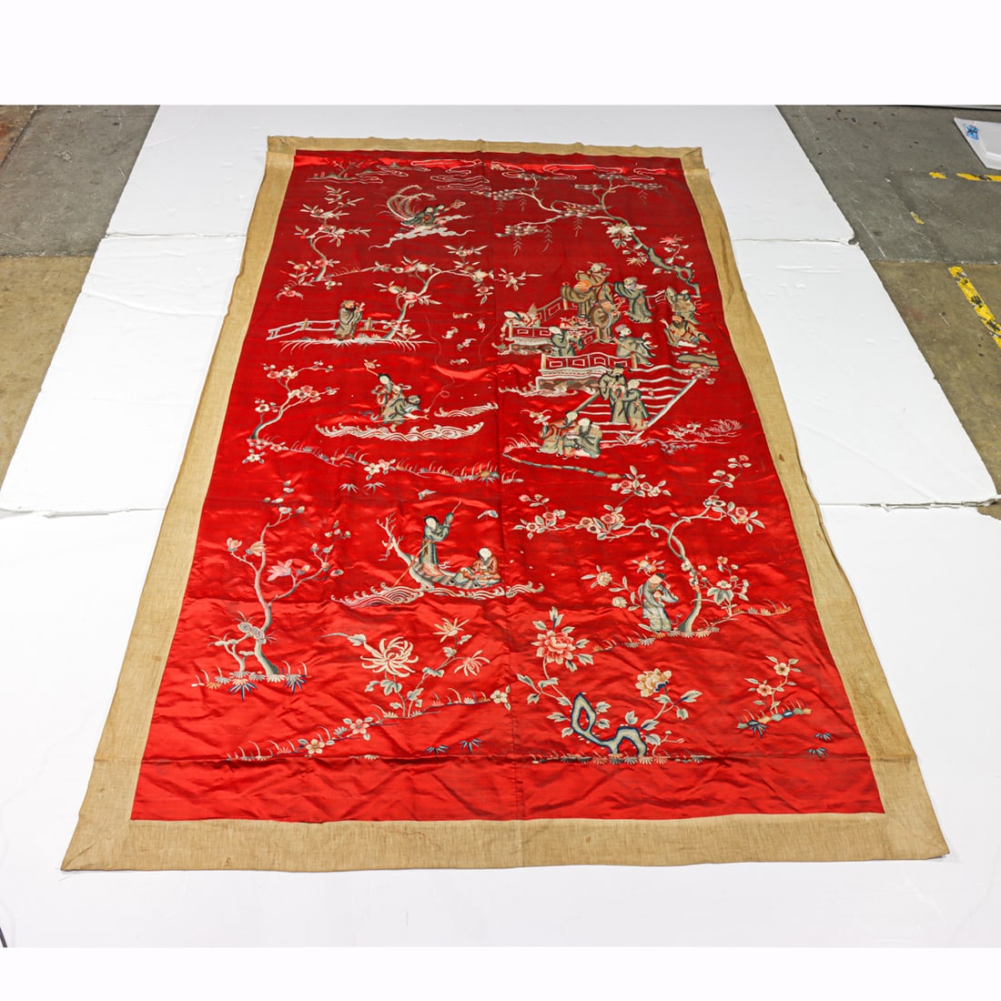A Chinese embroidered silk red-ground tapestry (1 of 2)