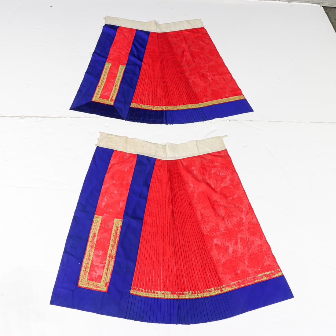 A pair of Chinese silk red ground skirts (1 of 3)