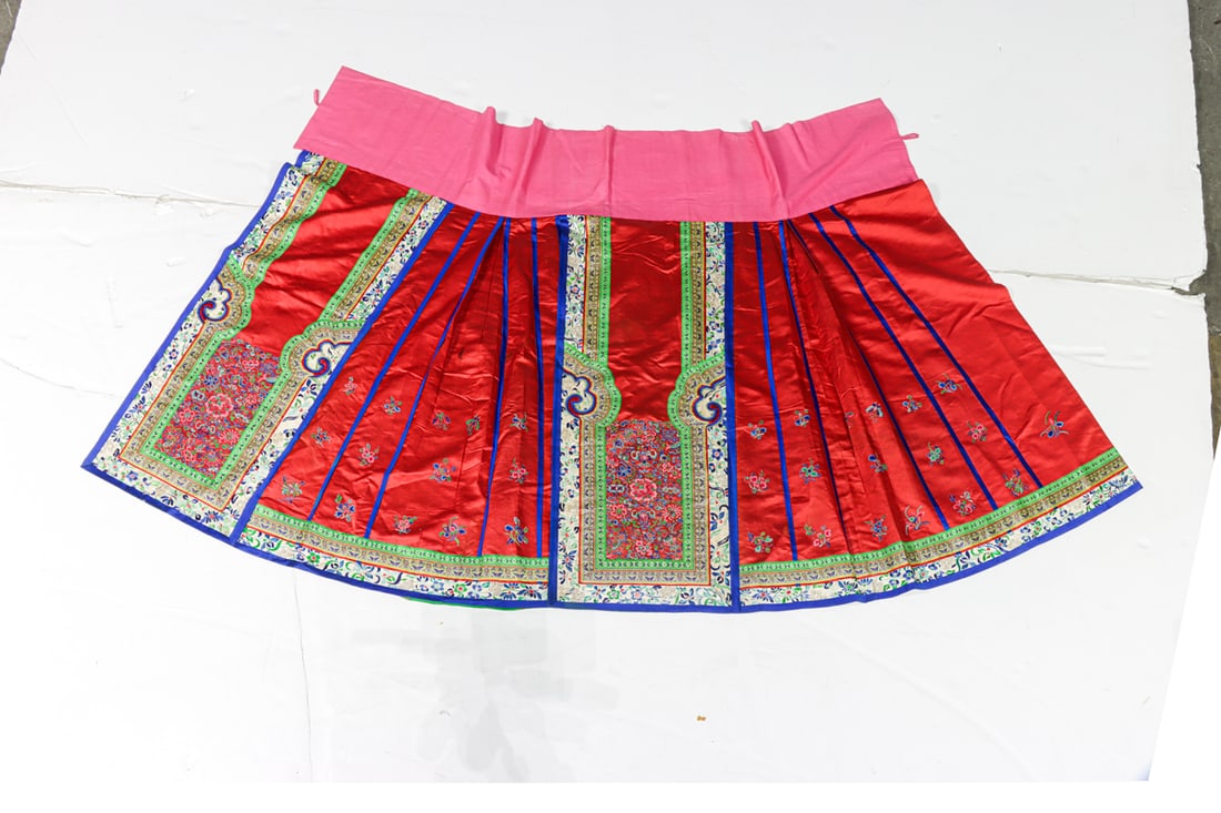 A Chinese embroidered silk red ground apron (1 of 3)