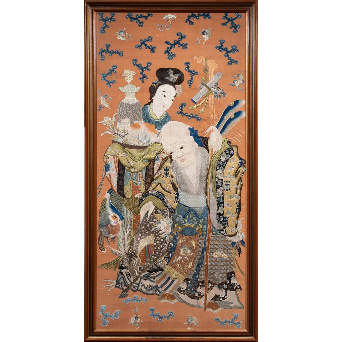 A Chinese silk embroidered 'Shoulao and Magu' panel (1 of 3)