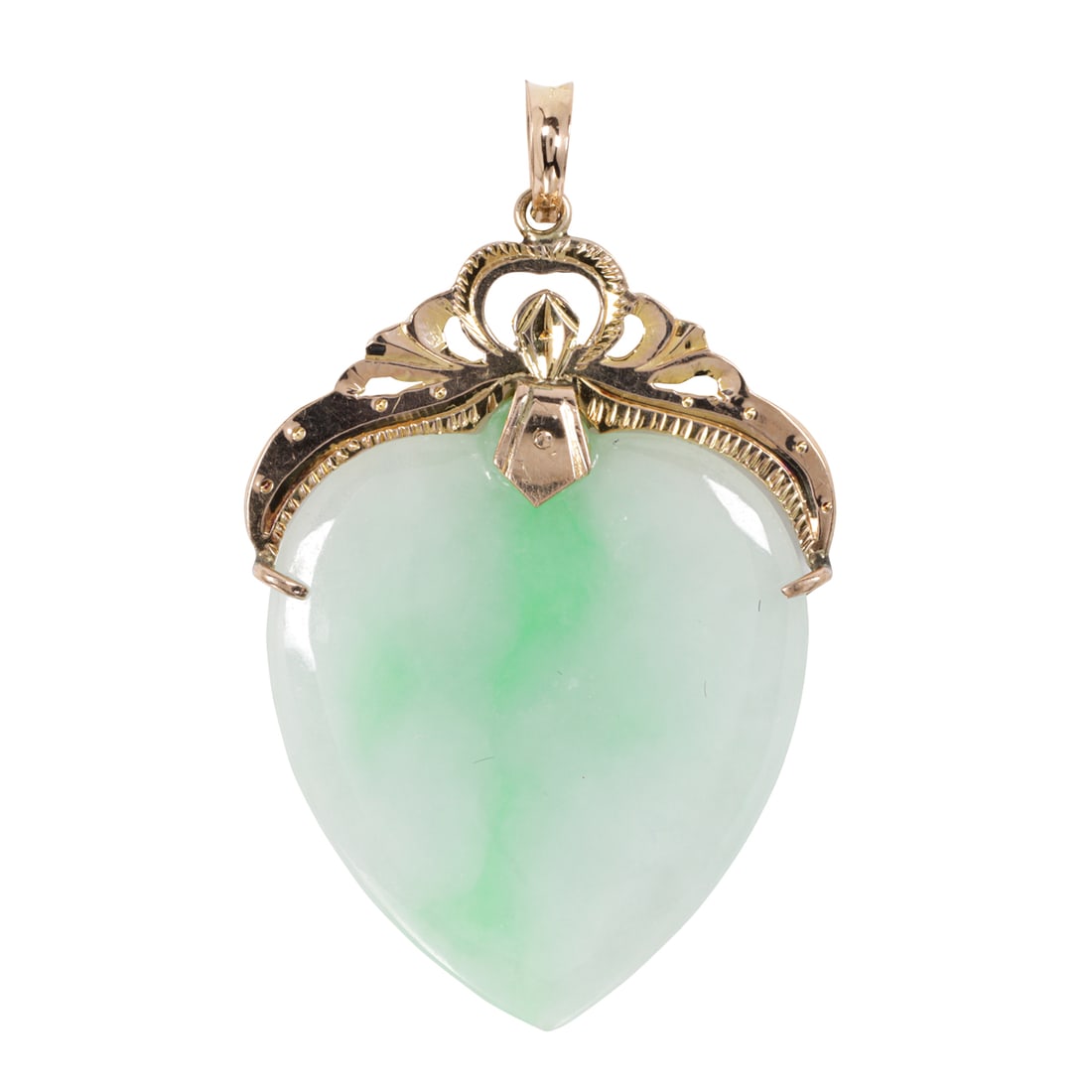A jade and 14k gold pendant: A jade and 14k gold pendantDesigned as a heart, with decorative 14k gold bail; length: 1 3/4 in; 7.10 grams