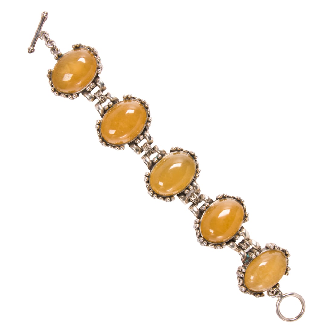 An Ilaria yellow quartz and silver bracelet: An Ilaria yellow quartz and silver braceletFeaturing 5 oval quartz cabochons measuring approximately 23.35 x 19.38 mm; 87.40 grams; length: 8 in