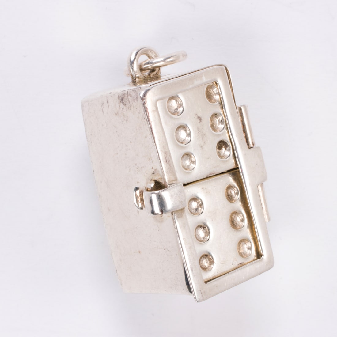A silver dice charm