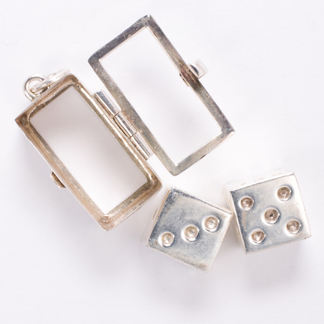 A silver dice charm - 2