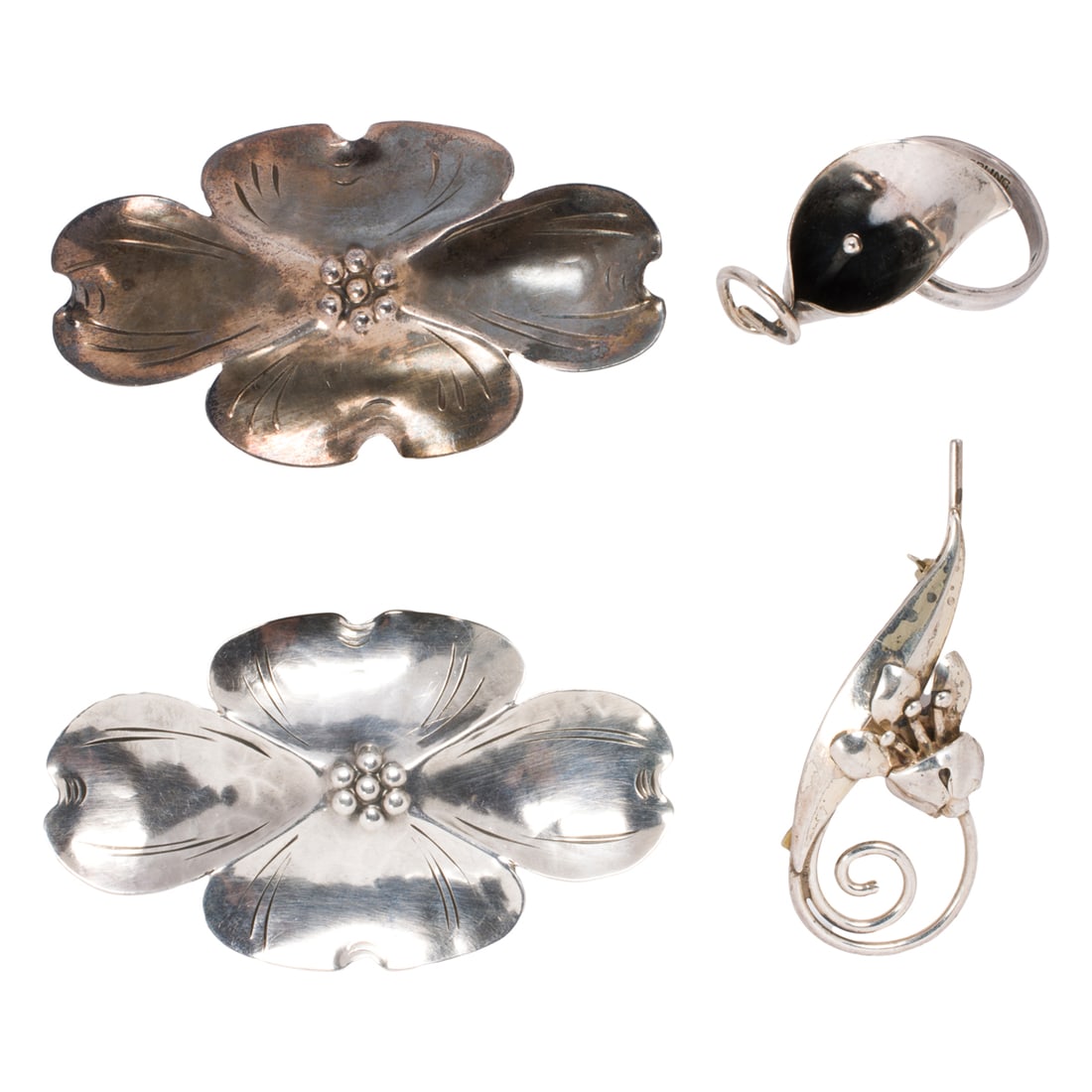 A group of silver jewelry: A group of silver jewelryComprising an assortment of silver jewelry pieces each of floral design; gross weight: 21.00 grams