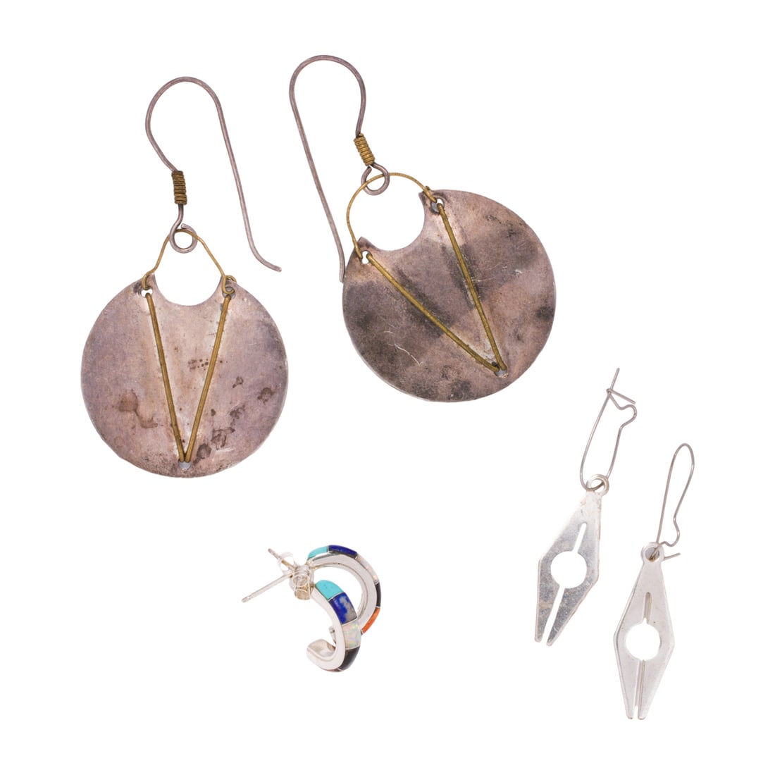 Three pairs of silver earrings: Three pairs of silver earringsComprising three pairs of silver earrings of varying styles and designs; gross weight: 9.85 grams