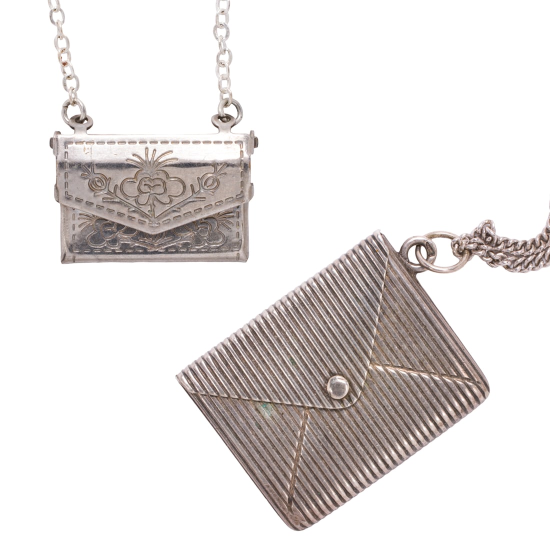 One silver and one silver-tone envelope necklace: One silver and one silver-tone envelope necklaceComprising two necklaces designed as articulated envelopes; gross weight: 17.80 grams