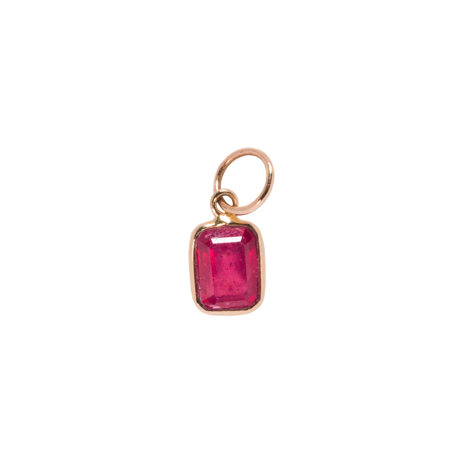 A glass-filled ruby and 14k gold charm (1 of 1)