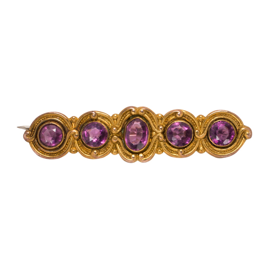 An antique gem-set, gold-tone pin: An antique gem-set, gold-tone pinSet with five oval and round-cut purple gemstones, within decorative setting; length: 1 1/2 in; 2.70 grams