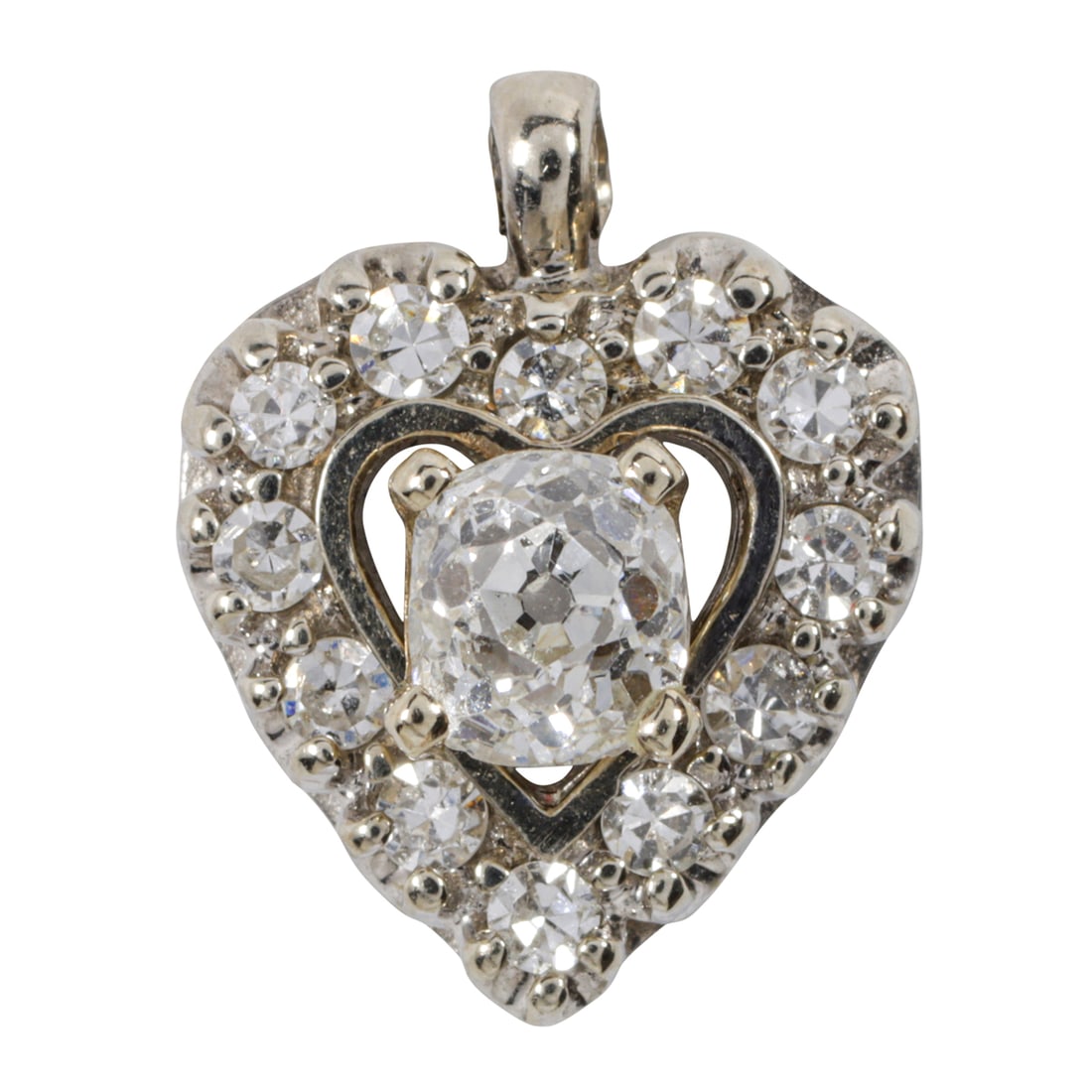 A diamond and 14k white gold heart pendant: A diamond and 14k white gold heart pendantDesigned as a heart, centering one old mine-cut diamond framed within 12 single-cut diamonds; length: 1/2 in; 1.65 grams