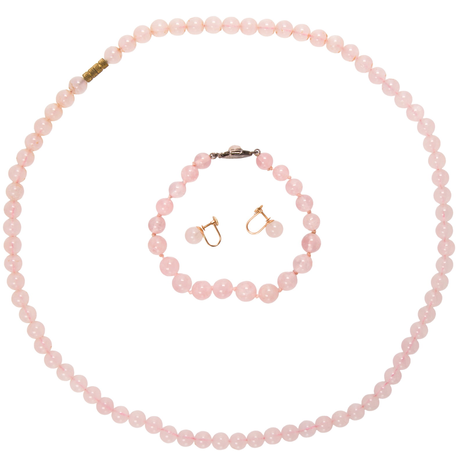 A group of beaded rose quartz jewelry: A group of beaded rose quartz jewelryComprising one necklace on metal clasp, one bracelet on rose quartz-set silver clasp, and one pair of ear-clips set in 14k gold; necklace length: 24 in; bracelet