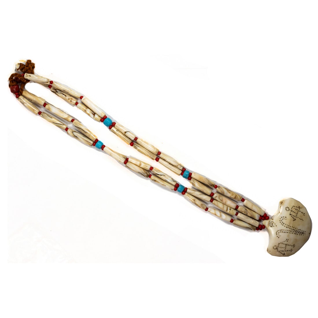 A Naga Shell Bead Necklace: Naga Shell Bead NecklaceThe pendant featuring figural decoration, on chank shell, carnelian, and turquoise beads; 140.3 grams; chain length: 31 inches; pendant size: 2 1/8 x 2 5/8 inches
