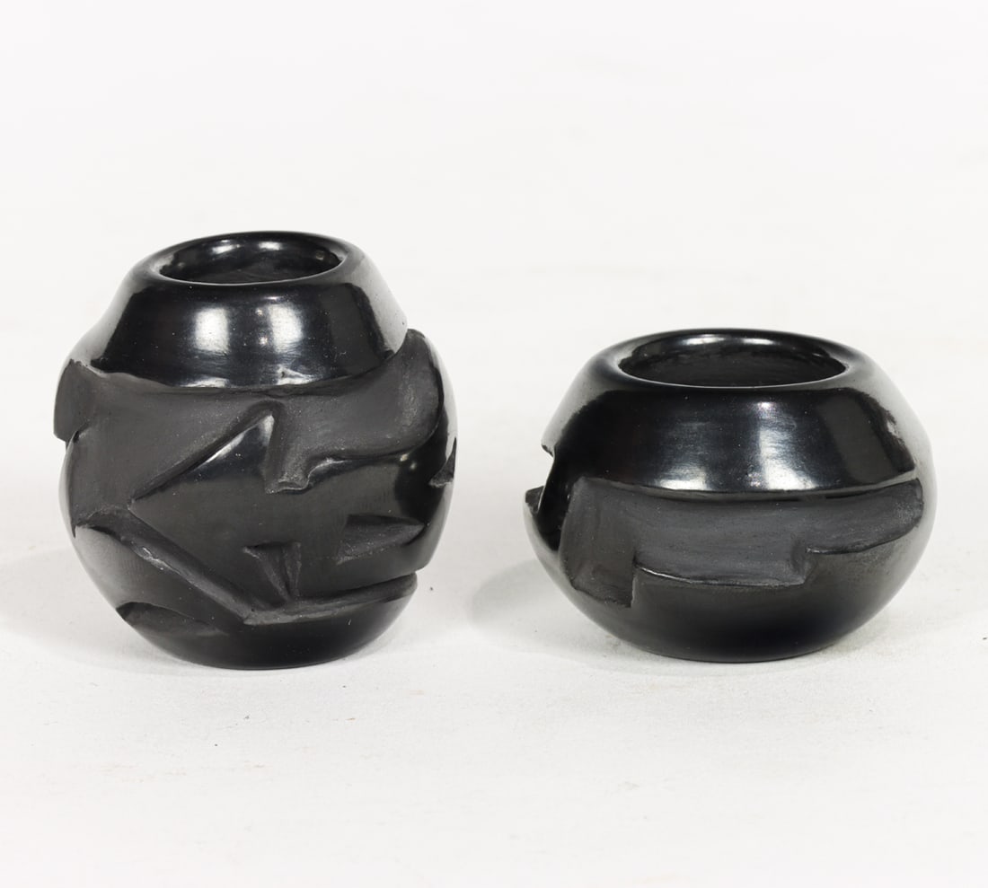 A group of two Santa Clara pueblo pottery blackware seed pots: A group of two Santa Clara pueblo pottery blackware seed pots, one signed by Madeline Naranjo, the other by Frances Naranjo Salazar, 1.25"h and 1.75"h