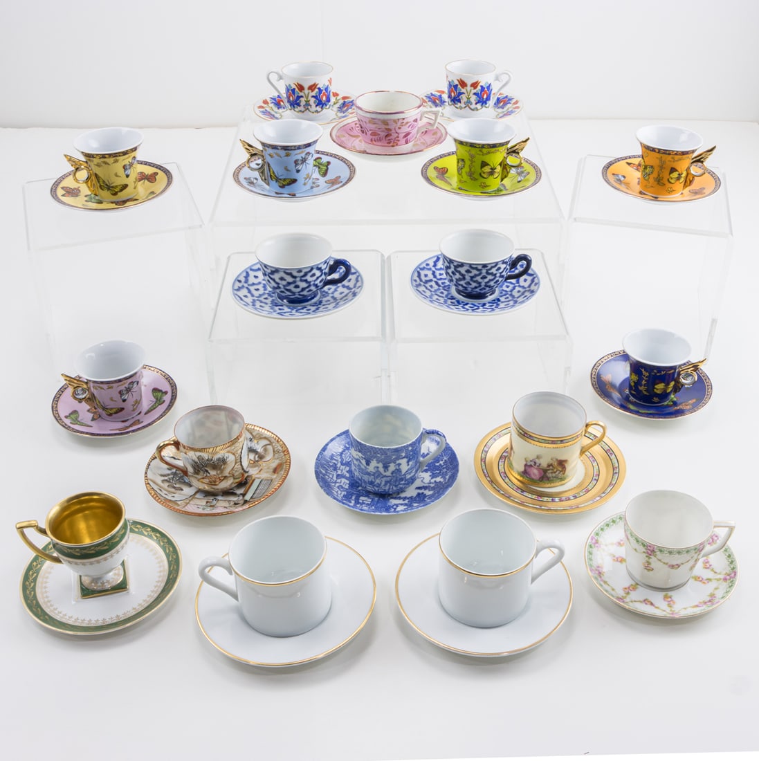 A group of eighteen demitasse cups and saucers: A group of eighteen demitasse cups and saucers, including Tiffany & Co., greatest 2.5"h x 5"dia (saucer) [36 total]