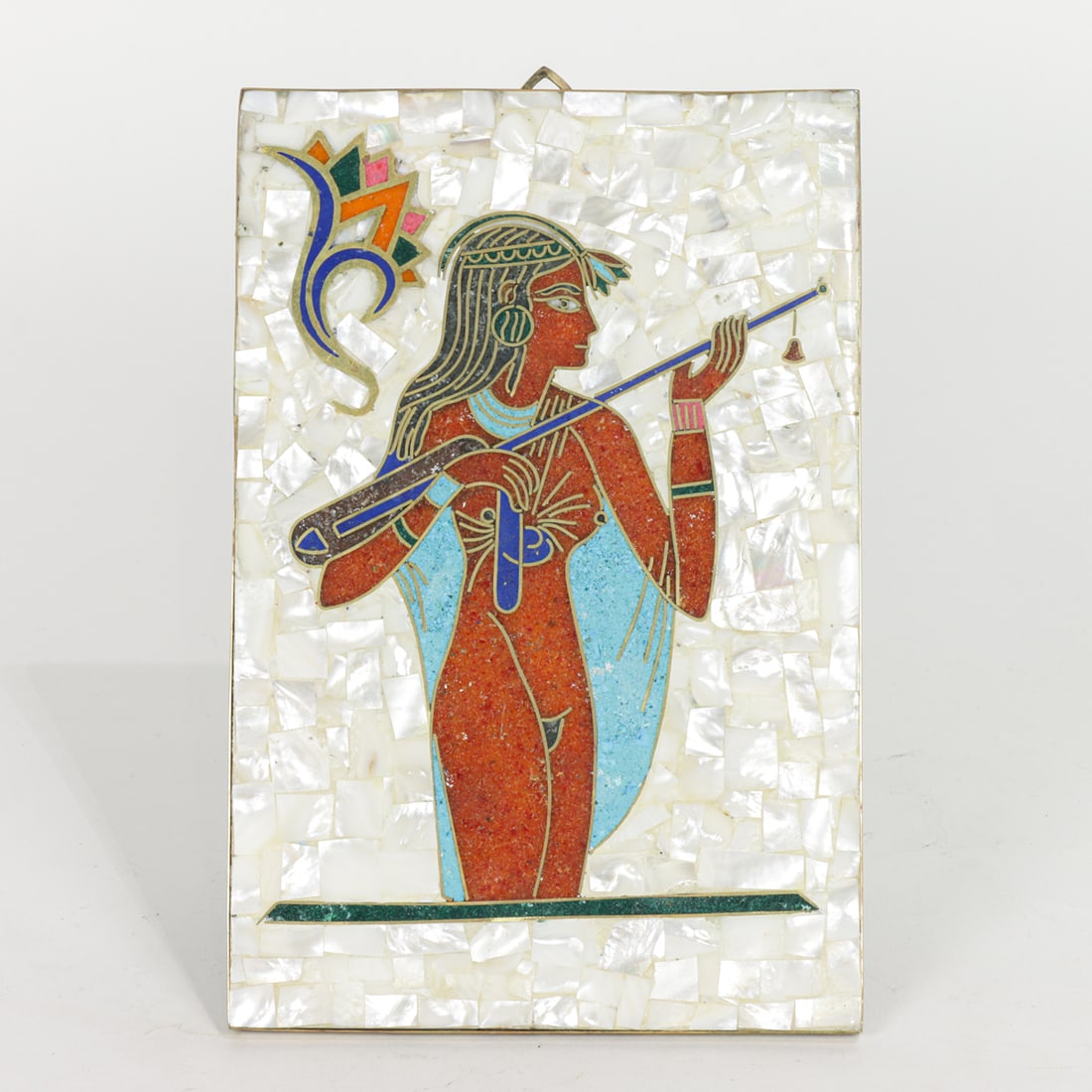 An inlaid panel depicting an Egyptian figure: An Egyptian style hardstone and mother-of-pearl inlaid panel, fitted with easel back, 12"h x 8"w