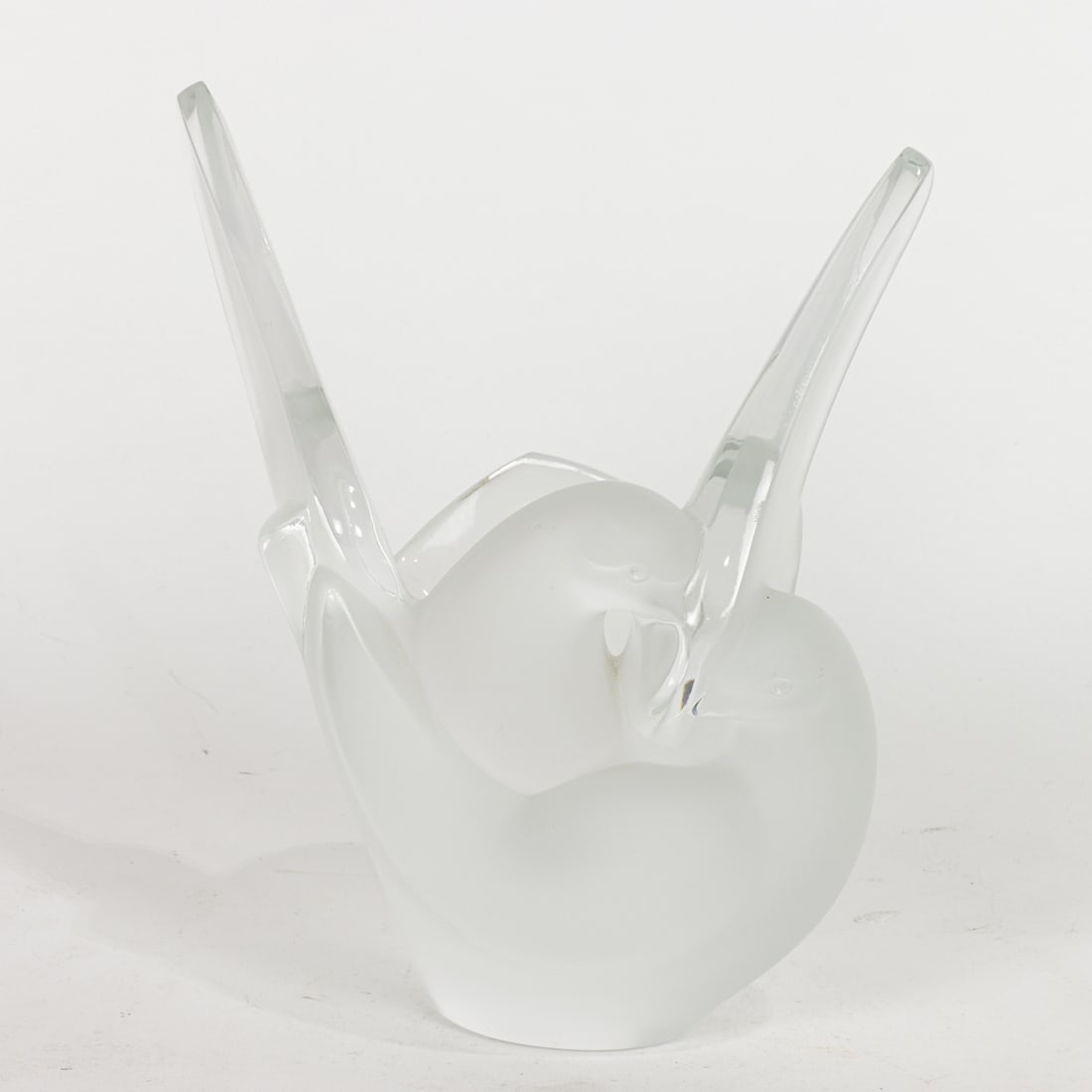 A Lalique glass Sylvie vase: A Lalique glass Sylvie vase, modeled as two-entwined doves, engraved factory mark, 8.5"h