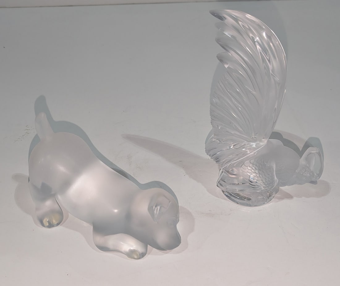 Two Lalique glass animals: Two Lalique glass animals, each with engraved factory signature, the first Coq Nain rooster, 8?h; the second figure of a mischievous puppy dog, includes factory presentation box, 7?l [2 total with