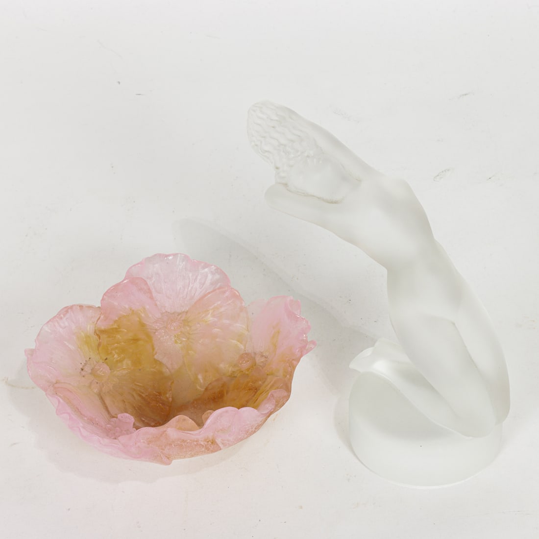 A Daum glass Coupelle flower bowl with a Lalique glass Chrysis figure: A Daum glass pate de vere Coupelle flower bowl and a Lalique glass Chrysis figure of a female nude, each with engraved factory signature, greatest 5"h [2 total]
